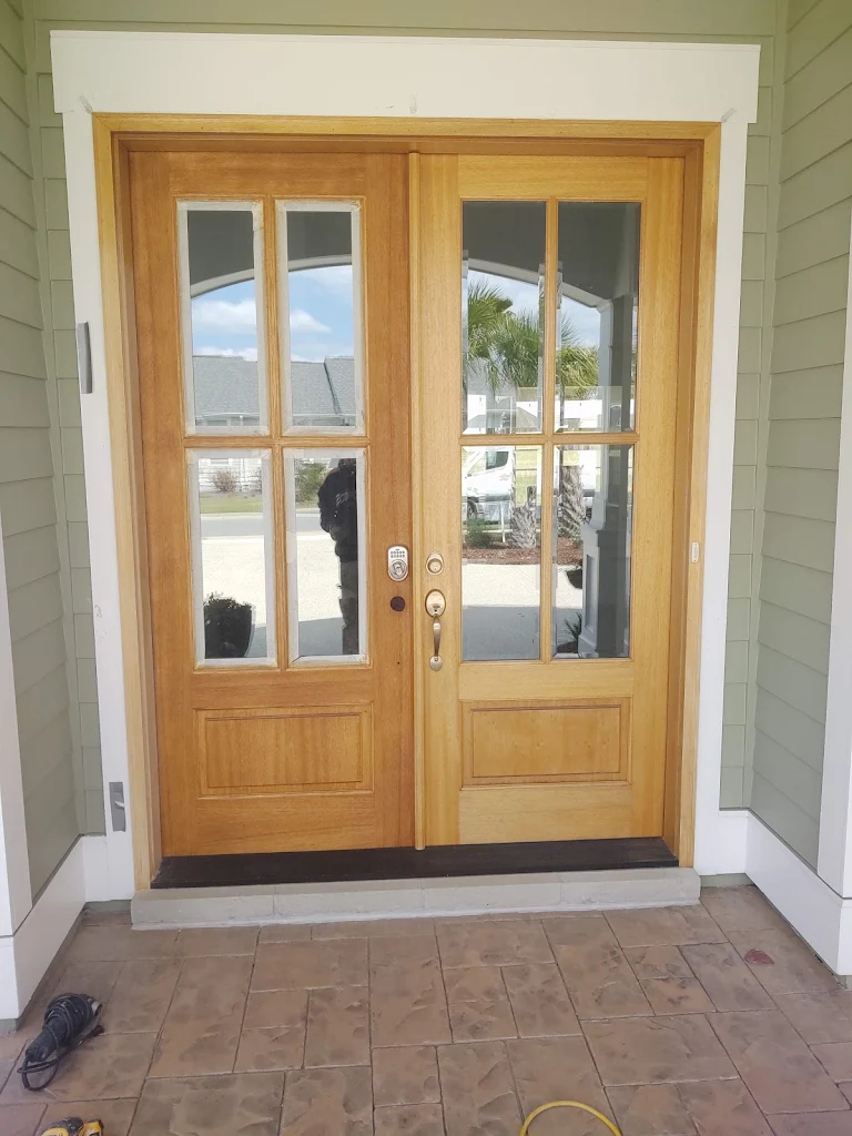 Front door with natural wood grain finish