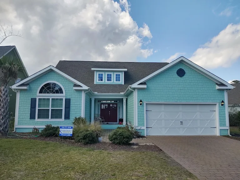 Home exterior finished in dark modern siding