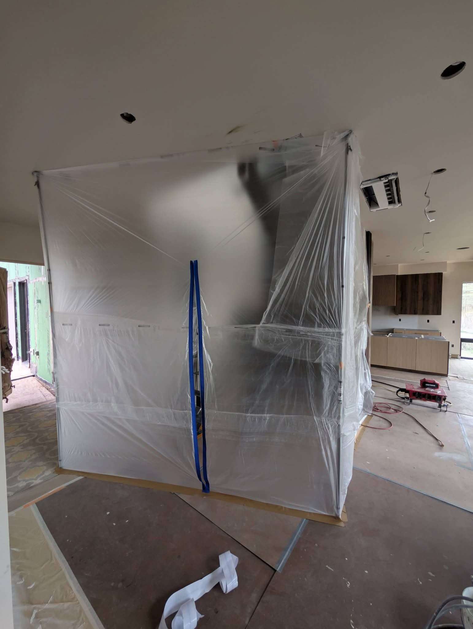 Two-story interior prepped for paint