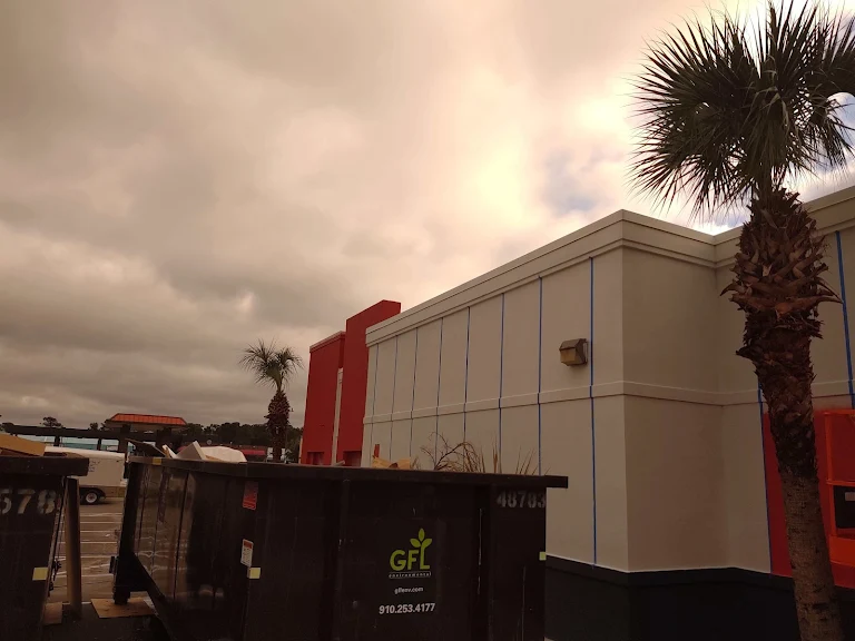 Team cleaning a commercial building facade